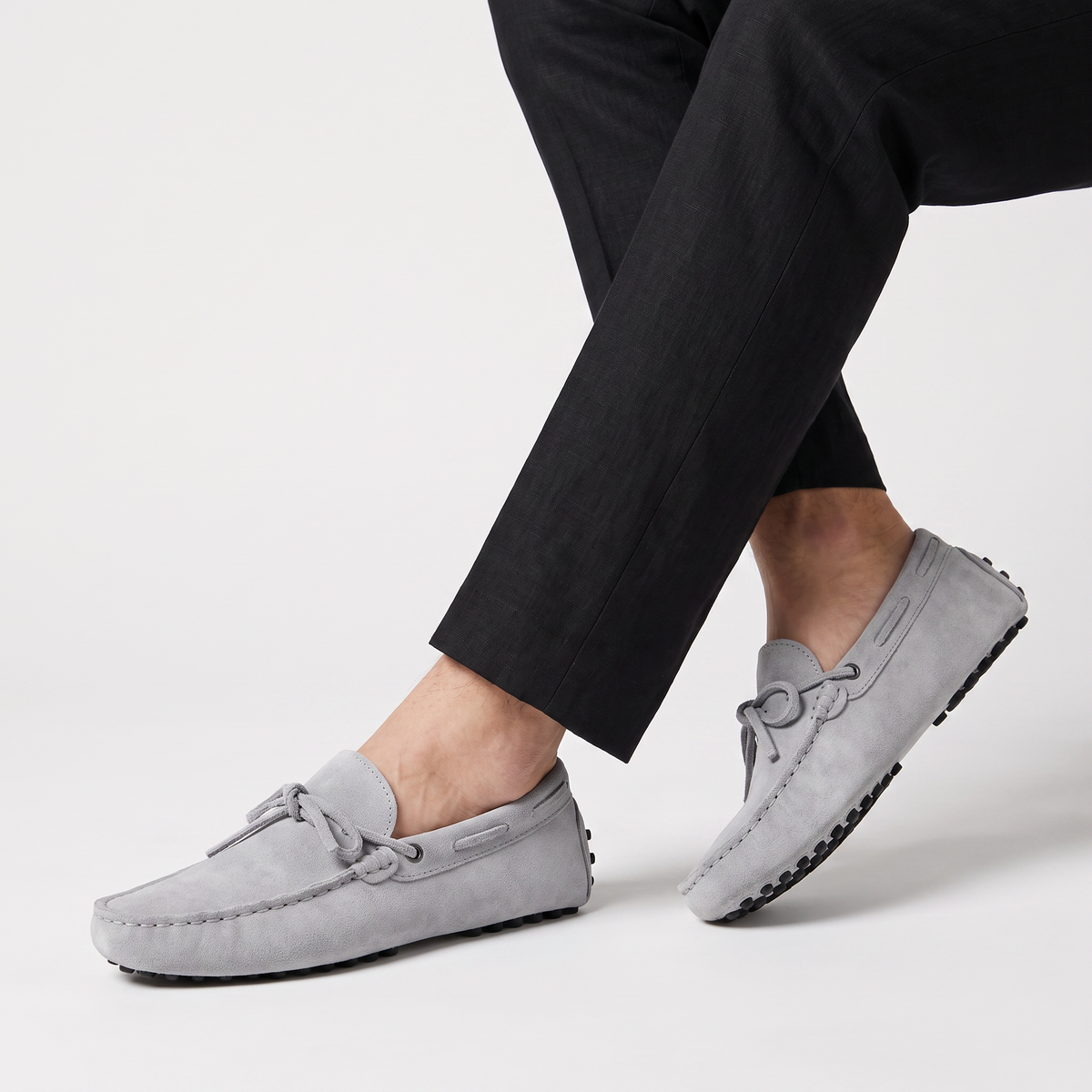 men's suede loafer with hand-stitched detail and front tie